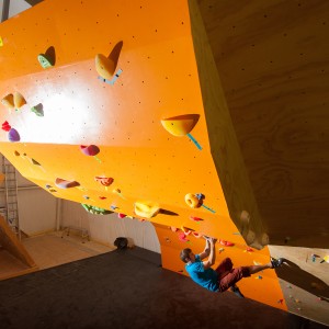 John on orange wall